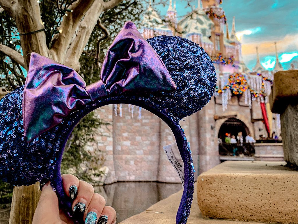 Minnie Mouse ears in front of Disneyland castle on New Years eve